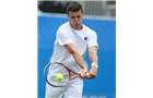 EASTBOURNE, ENGLAND - JUNE 14: Ken Skupski of Great Britain plays a forehand against Remi Boutillier of France during their Men's Singles qualifying match on day one of the Aegon International at Devonshire Park on June 14, 2014 in Eastbourne, England.  (Photo by Steve Bardens/Getty Images)